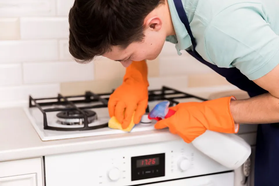 Gas oven bake burner lit with a steady blue flame
